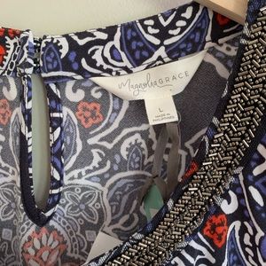 Women’s beaded neckline top.